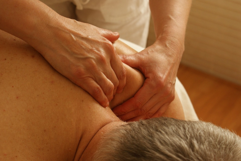 massaging the shoulder